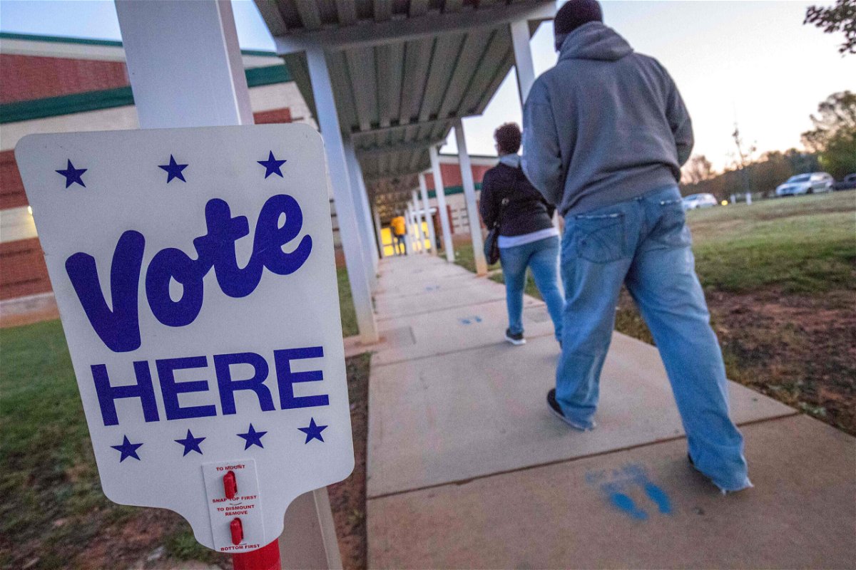 <i>Grant Baldwin/AFP/Getty Images</i><br/>Voters arrive at Waddell Language Academy in Charlotte