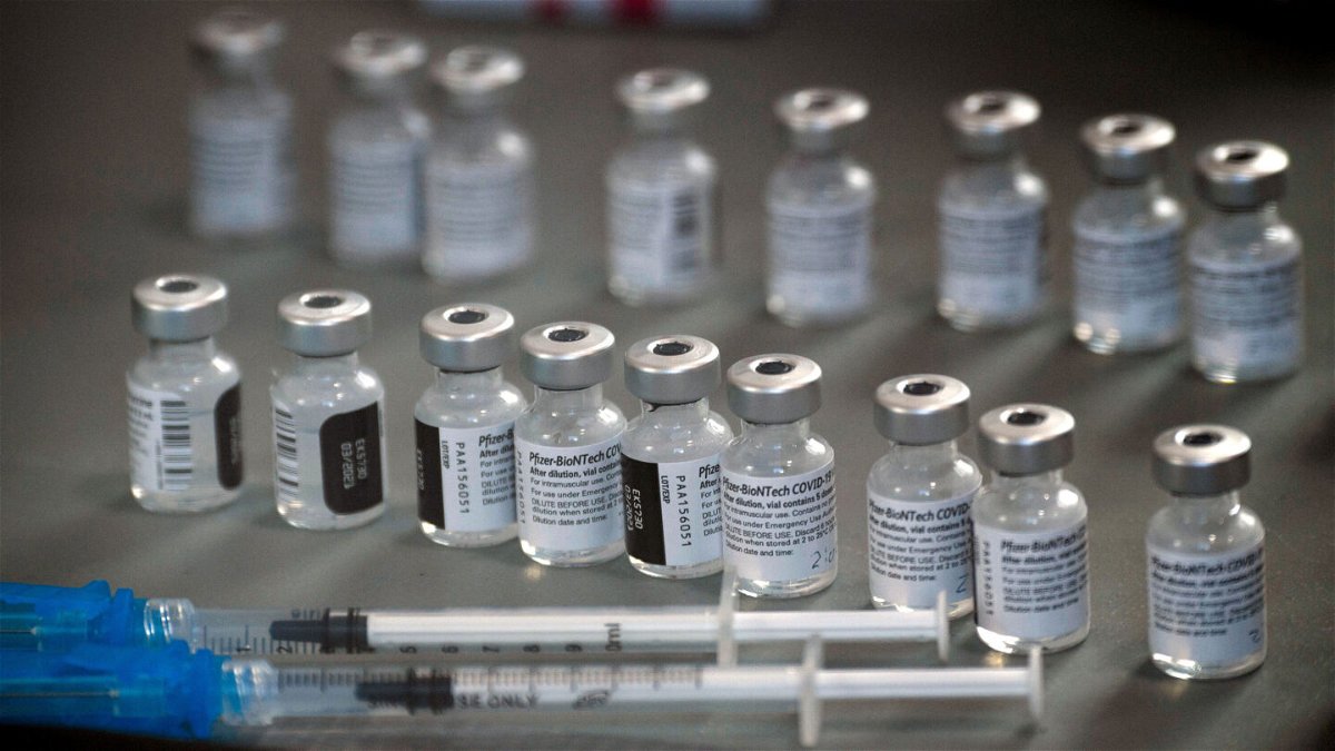 <i>Patrick T. Fallon/AFP/Getty Images</i><br/>Vials of the Pfizer-BioNTech Covid-19 vaccine are prepared to be administered to front-line health care workers under an emergency use authorization at a drive-up vaccination site from Renown Health in Reno