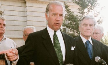Then-Senator Joe Biden speaks with the media alongside other members of Congress outside the U.S. Capitol Police Headquarters in the early afternoon of September 11