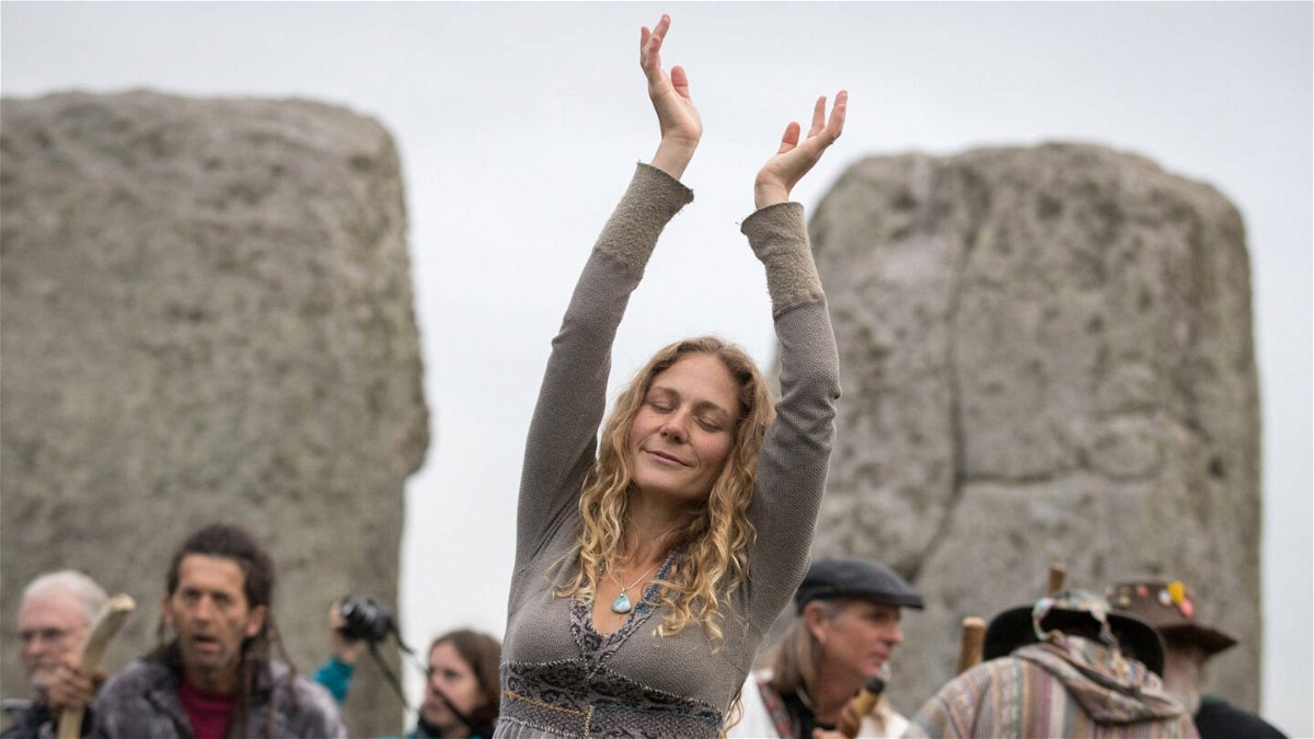 <i>Matt Cardy/Getty Images</i><br/>A woman dances as druids