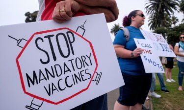Anti-vaccination protesters hold a rally against Covid-19 vaccine mandates in Santa Monica