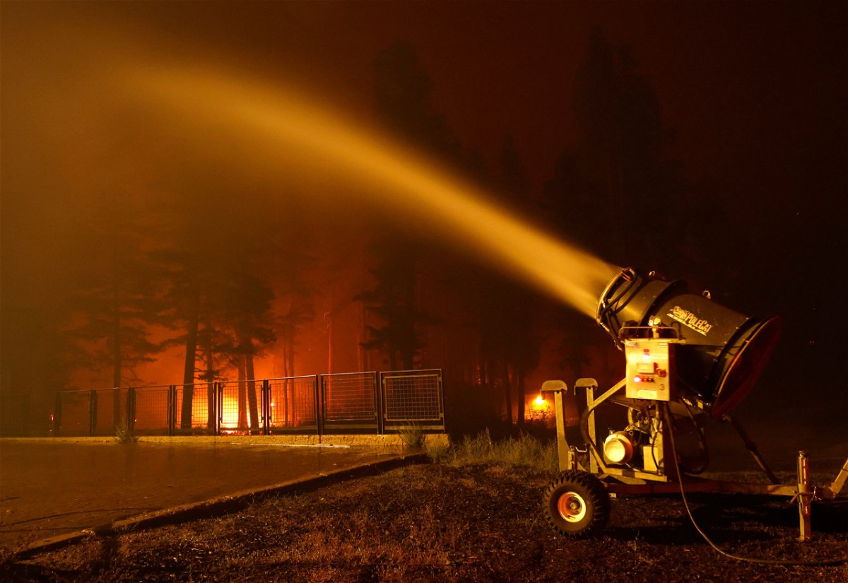 <i>Justin Sullivan/Getty Images</i><br/>Lake Tahoe ski resorts near the Caldor Fire in Northern California are helping firefighter crews hold off the flames