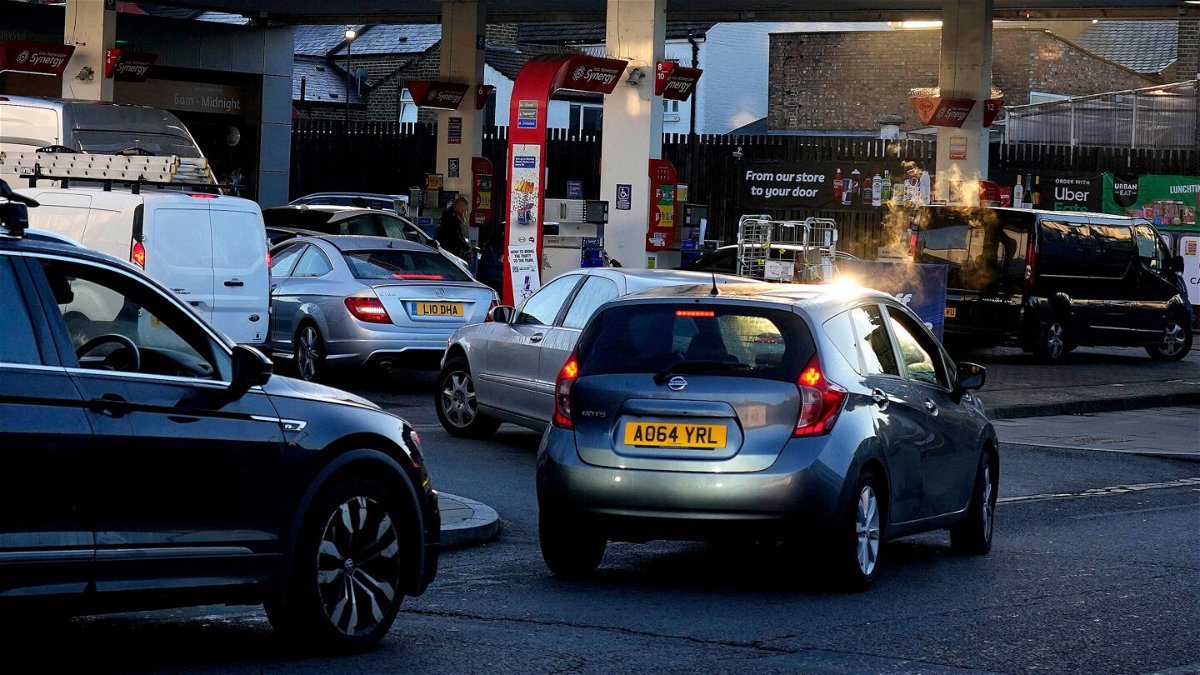 <i>Frank Augstein/AP</i><br/>Soldiers will be on the roads 'in days' to help deliver fuel to service stations. Drivers queue for fuel at a service station in London