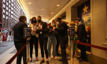 Guests have their vaccine cards and identification checked before entering the theatre at the opening night of previews for "Pass Over" at the August Wilson Theatre in Manhattan on August 4.