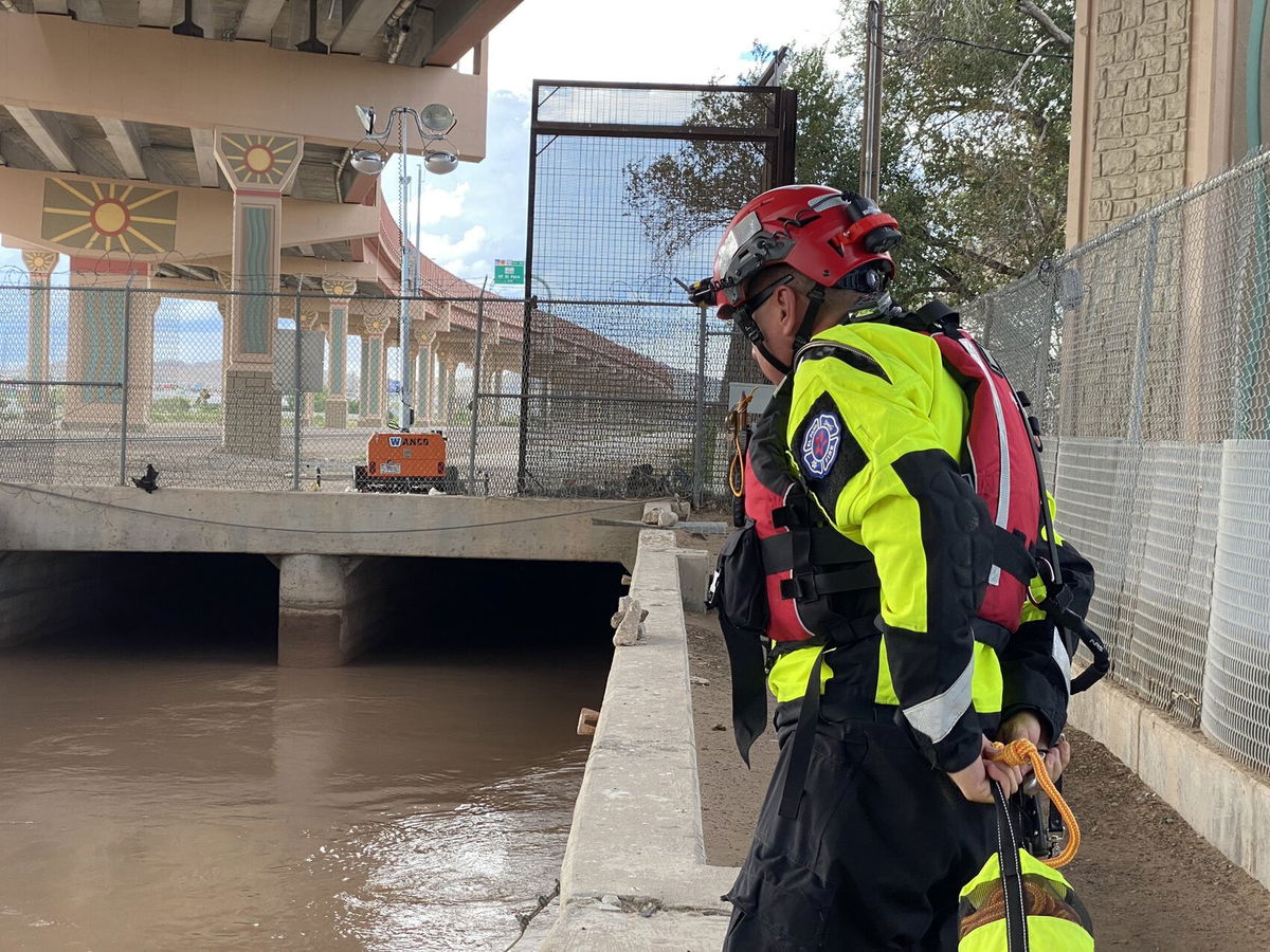 A water rescue team member looks for a person in the water in the Chihuahuitita area.