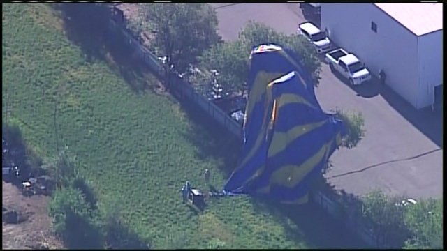 A hot air balloon that crashed into a power line and trees in Albuquerque.