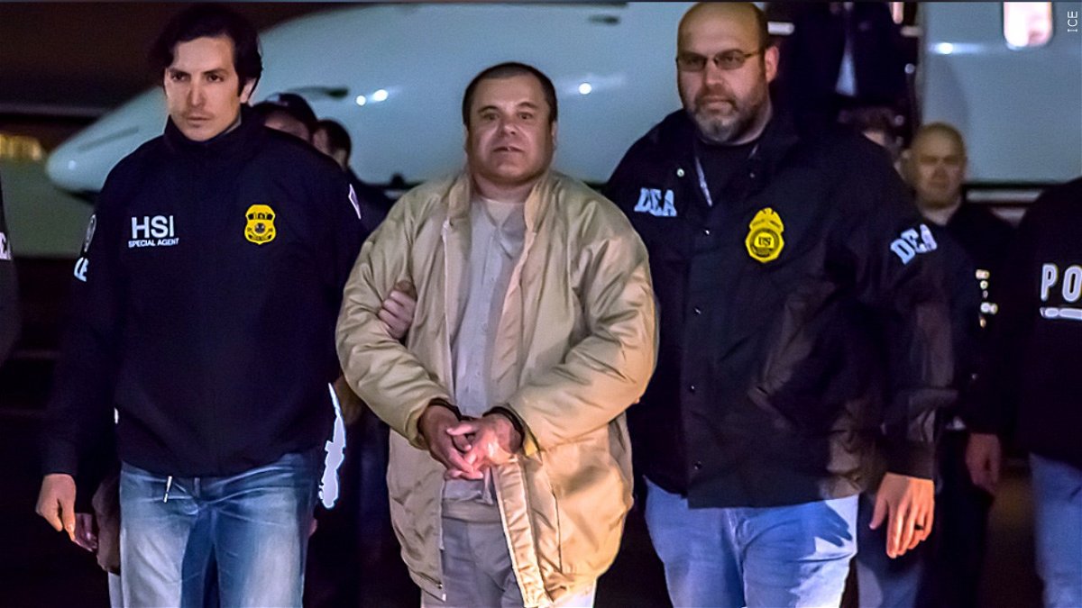 Joaquin Archivaldo Guzman Loera (El Chapo) under heavy escort by special agents ICE) Homeland Security Investigations and the DEA after his arrest in 2017.