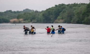 Migrants cross the Rio Grande into the US at Del Rio