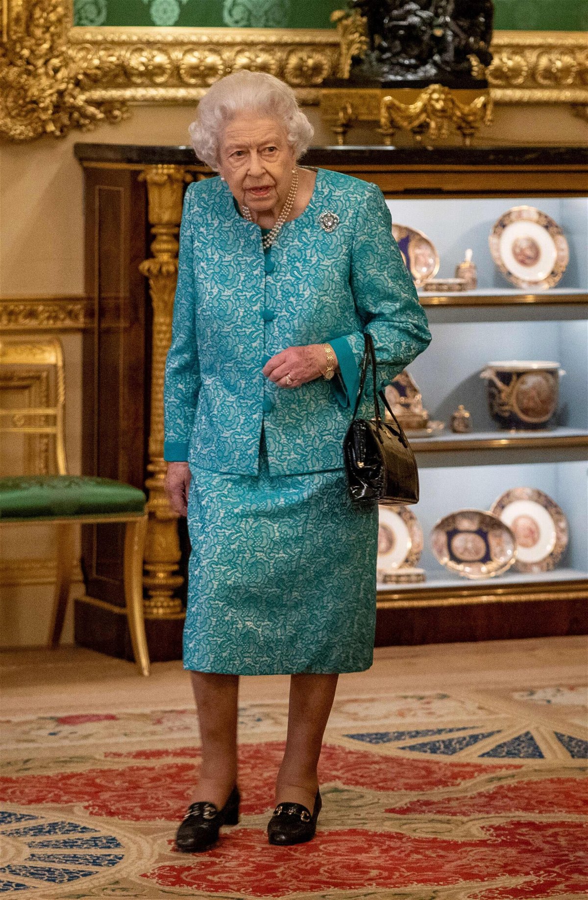 <i>Arthur Edwards/Pool/Getty Images</i><br/>Queen Elizabeth II arrives to greet guests during a reception for international business and investment leaders at Windsor Castle to mark the Global Investment Summit on October 19 in Windsor