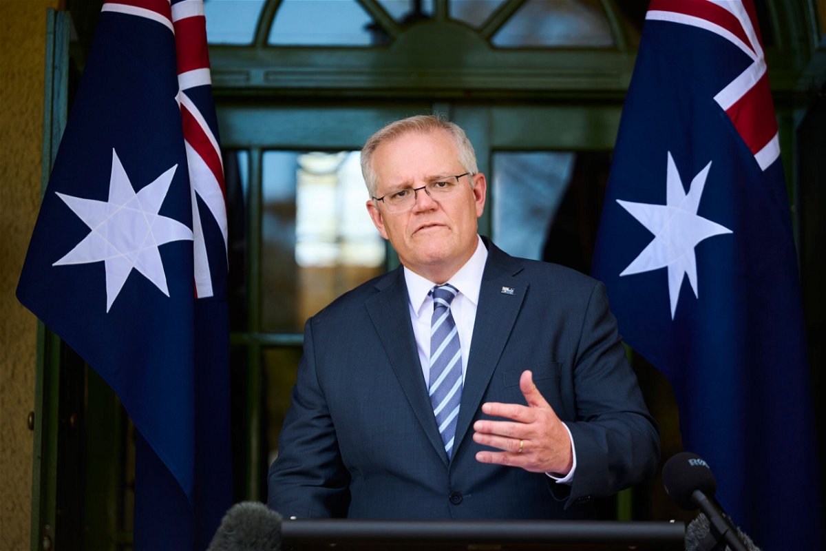 <i>Rohan Thomson/Getty Images</i><br/>Australian Prime Minister Scott Morrison announced Friday he will travel to Glasgow for the COP26 climate summit. Morrison is shown here speaking at a new conference on October 7 in Canberra