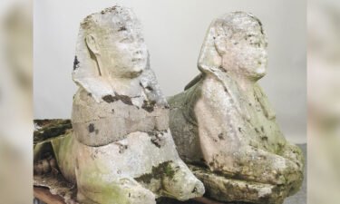 A pair of carved stone statues used as garden ornaments have sold for more than £195