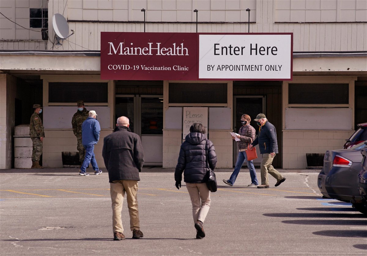 <i>Gregory Rec/Portland Press Herald/Getty Images</i><br/>Some Maine health care workers are challenging the state vaccine mandate. Pictured is the Maine Health Covid-19 vaccination clinic at Scarborough Downs in March.