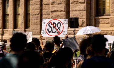 Texas Attorney General Ken Paxton urged a powerful federal appeals court on Thursday to allow a state law that bars abortion after the detection of a fetal heartbeat to remain in effect while legal challenges play out. Abortion rights activists rally at the Texas State Capitol on September 11