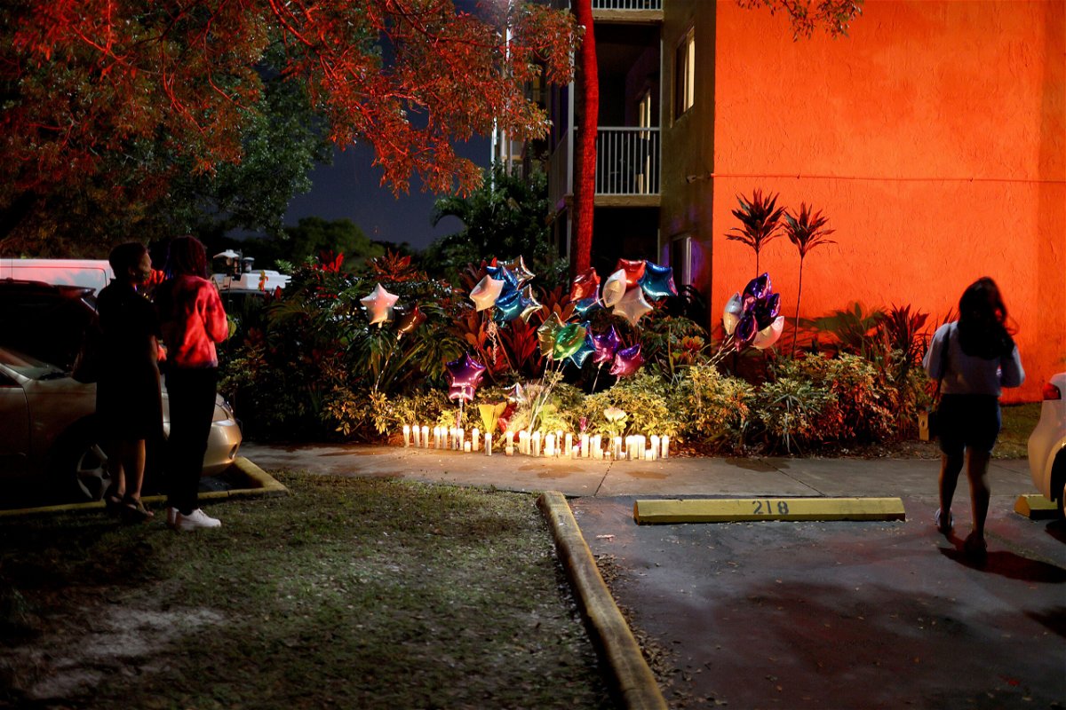 <i>Joe Raedle/Getty Images</i><br/>People stand near the memorial on the spot where 18-year-old Dwight 