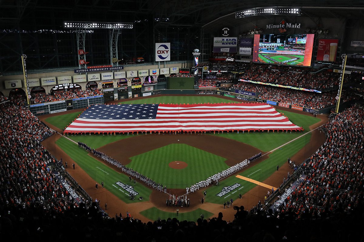 <i>Alex Trautwig/Getty Images</i><br/>The Astros and Braves line up for the national anthem prior to the first pitch in Houston on October 26.