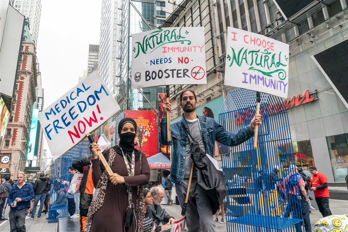 <i>Lev Radin/Pacific Press/LightRocket/Getty Images</i><br/>Public health groups worry threats to local officials could escalate as US plans vaccine rollout for kids. People protest on Times Square against vaccination mandates.