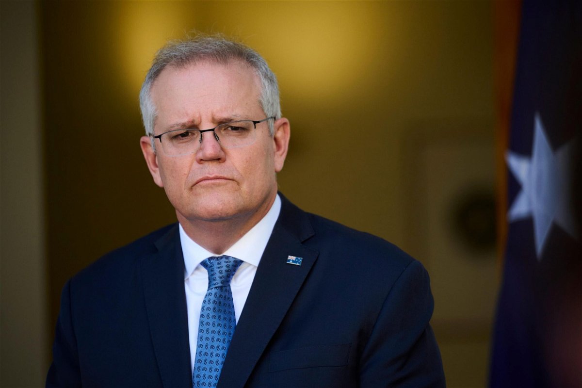 <i>Rohan Thomson/Getty Images</i><br/>Australia will reopen international borders to fully vaccinated citizens. Australian Prime Minister Scott Morrison is seen here at Parliament House on August 23