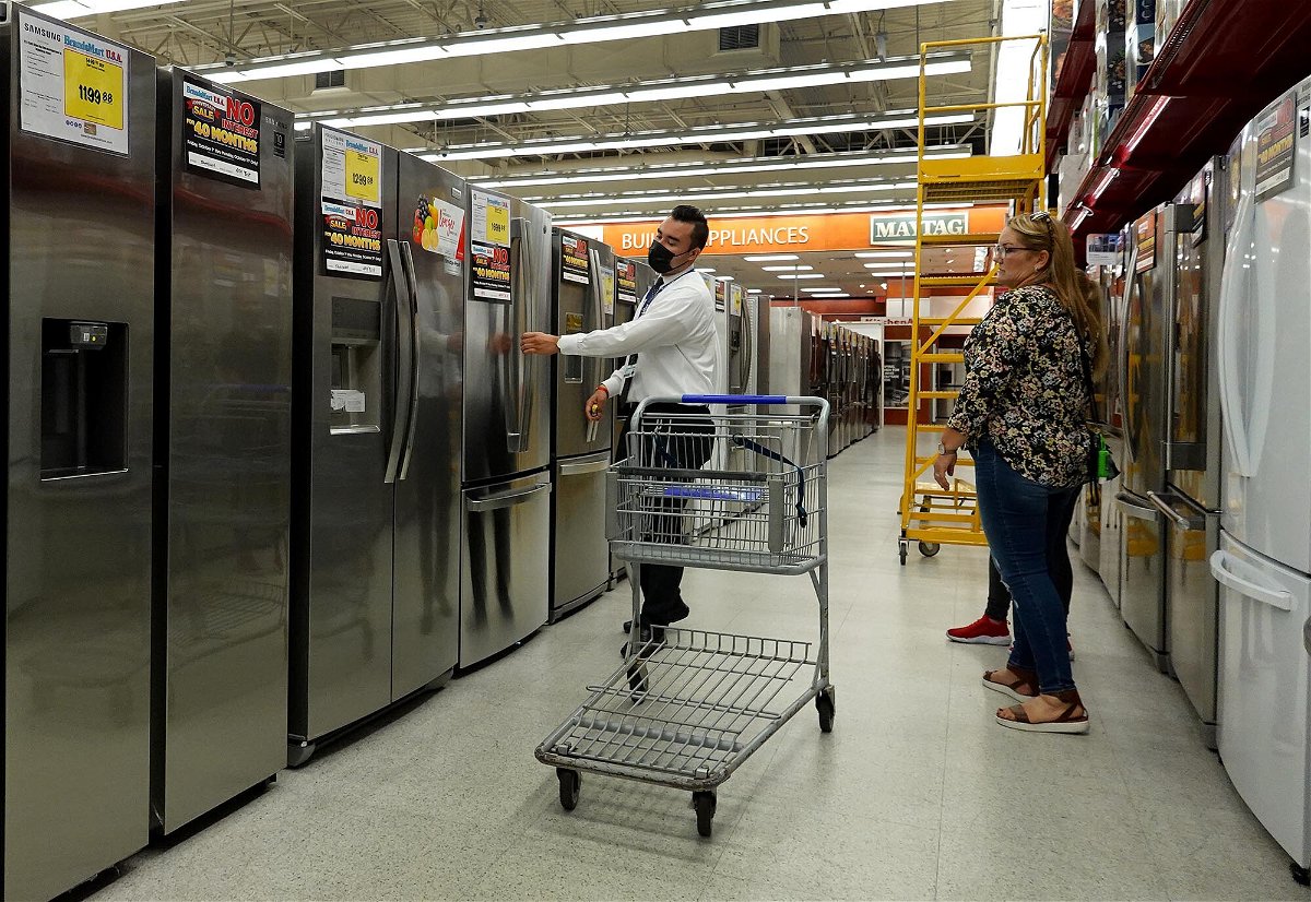 <i>Joe Raedle/Getty Images</i><br/>A customer looks at appliances for sale at a BrandsMart USA store on October 08
