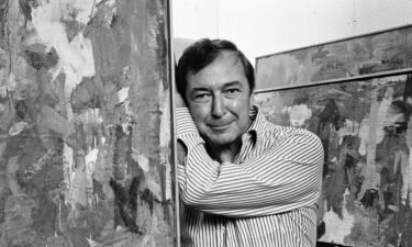 Artist Jasper Johns photographed with his work at the Whitney in New York City