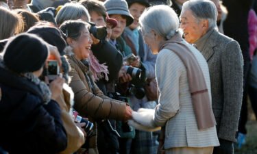 Fumiko Shirataki shakes hands with Japan's then-Empress Michiko in January 2019.