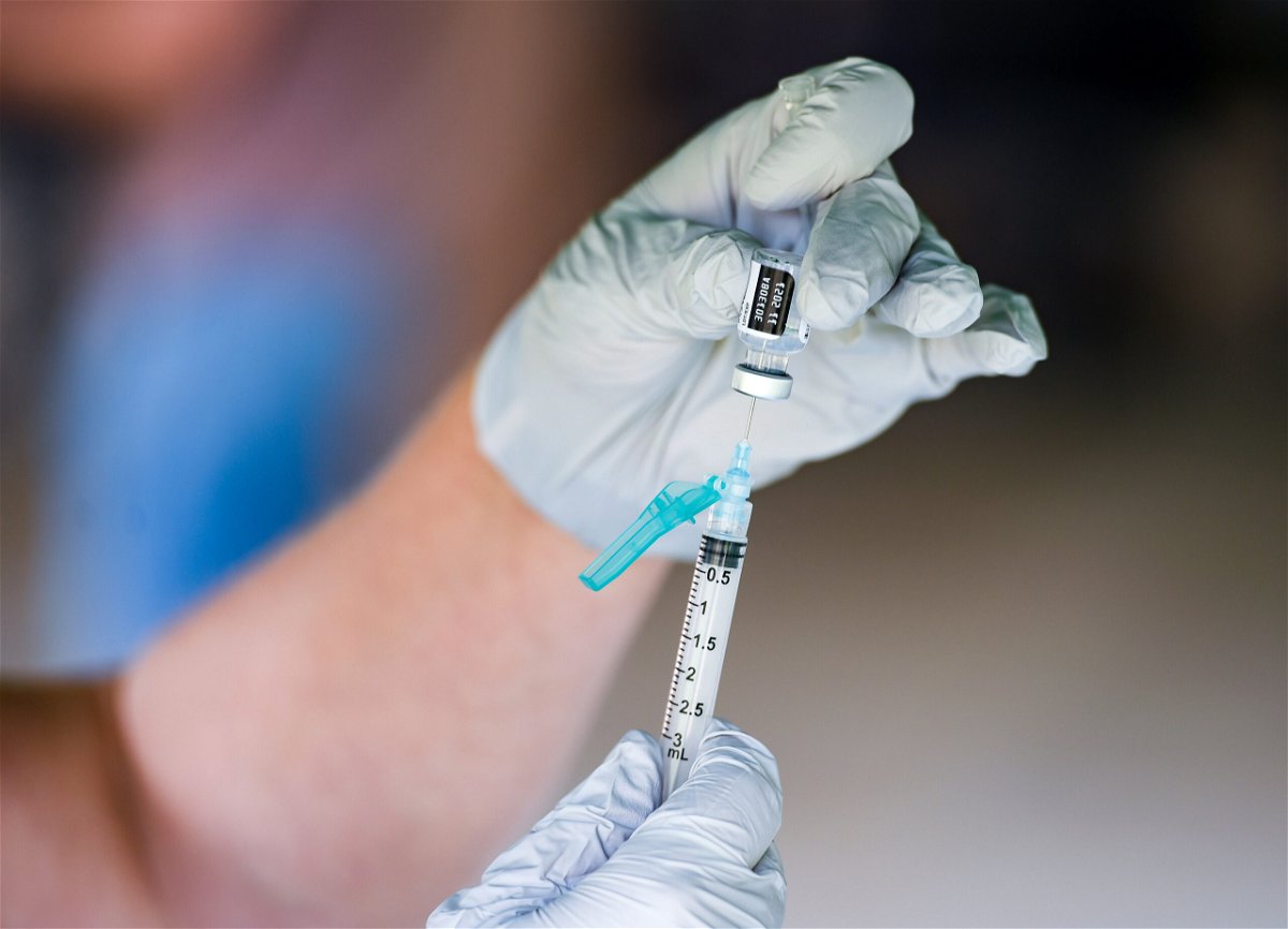 <i>Ben Hasty/Reading Eagle/Getty Images</i><br/>A doctor prepares a vaccine shot.