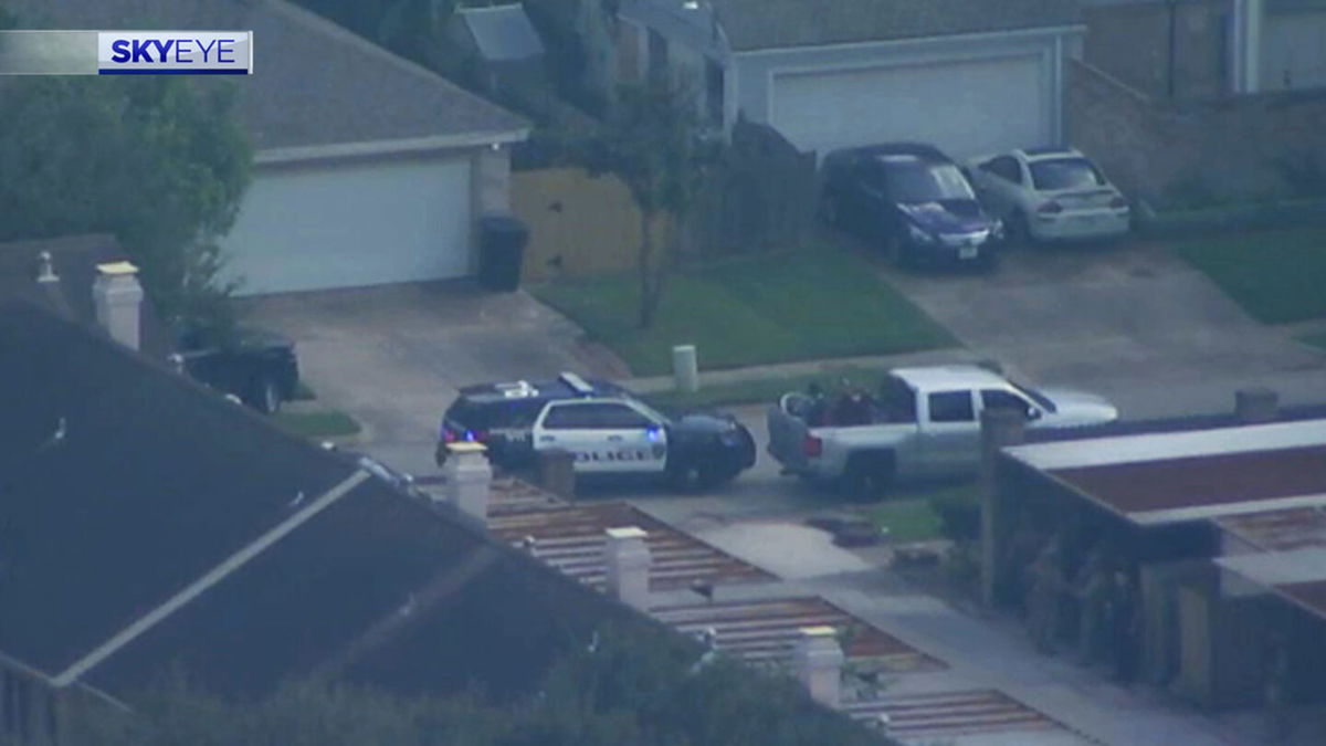 Scene of standoff in Houston with armed passenger holding driver hostage.