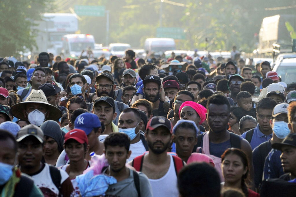 A caravan of migrants, mostly from Central America, head north along coastal highway just outside of Huehuetan at Chiapas State, Mexico.