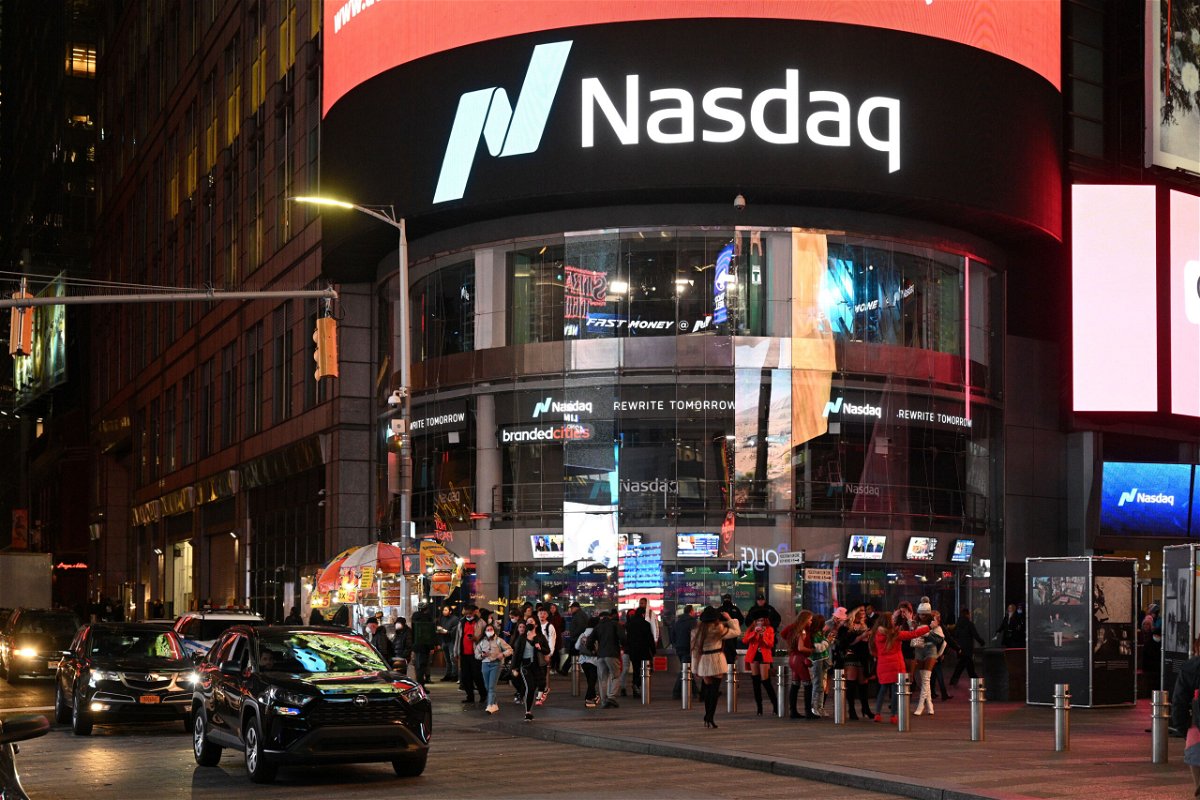 <i>Erik Pendzich/Shutterstock</i><br/>US futures and oil plunge as new Covid variant fears slam global markets. People here walk outside the Nasdaq building in Times Square