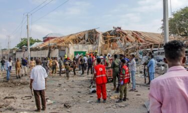 Eight dead and 13 children injured as bomb explodes near school in Somalia. Security forces and rescue workers search for bodies at the blast scene in Mogadishu