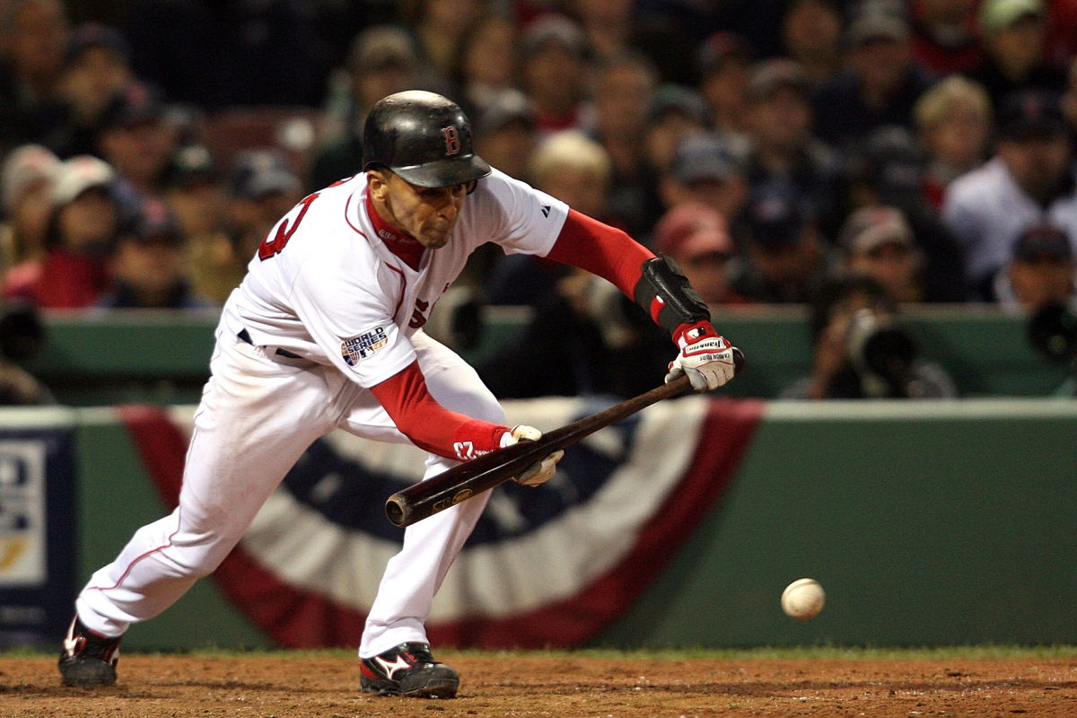 <i>Nick Laham/Getty Images</i><br/>Julio Lugo lays down a bunt against the Colorado Rockies during Game Two of the 2007 World Series at Fenway Park on October 25