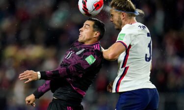 Mexico's Rogelio Funes Mori challenges for the ball against Walker Zimmerman.