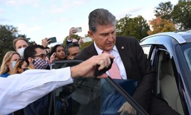 Sen. Joe Manchin said he plans to provide "clarity" later on Monday on where he sees his party's massive economic plan headed. Manchin is shown here after leaving the US Capitol in Washington