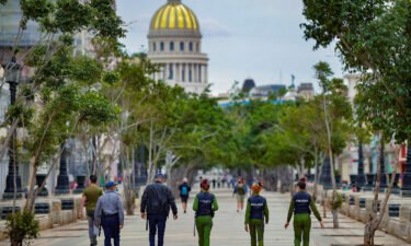 The city of Havana saw a heavy police presence on Monday morning as authorities prepared to face potential protesters. Police officers are shown along El Paseo del Prado street in Havana