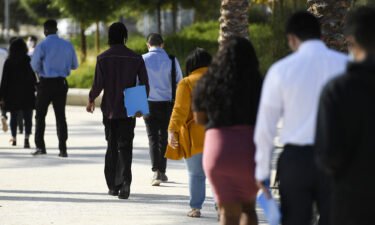 People wait in line to attend a job fair for employment with SoFi Stadium and Los Angeles International Airport employers