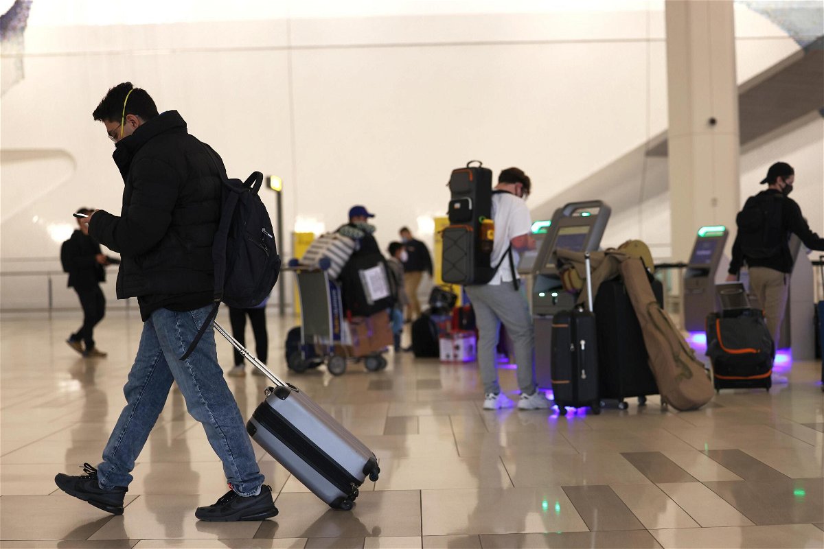 <i>Michael M. Santiago/Getty Images</i><br/>People check in for their flights at LaGuardia Airport on November 25