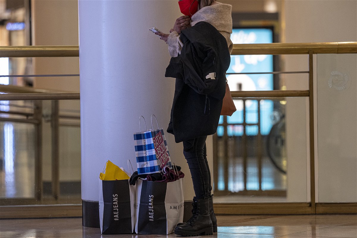 <i>David Paul Morris/Bloomberg/Getty Images</i><br/>American households are carrying record amounts of debt as home and auto prices surge. A shopper is shown here with retail bags inside the Westfield San Francisco Centre shopping mall in San Francisco