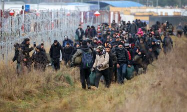 A group of migrants walk along the Belarusian-Polish border in Belarus' Grodno region on November 12.