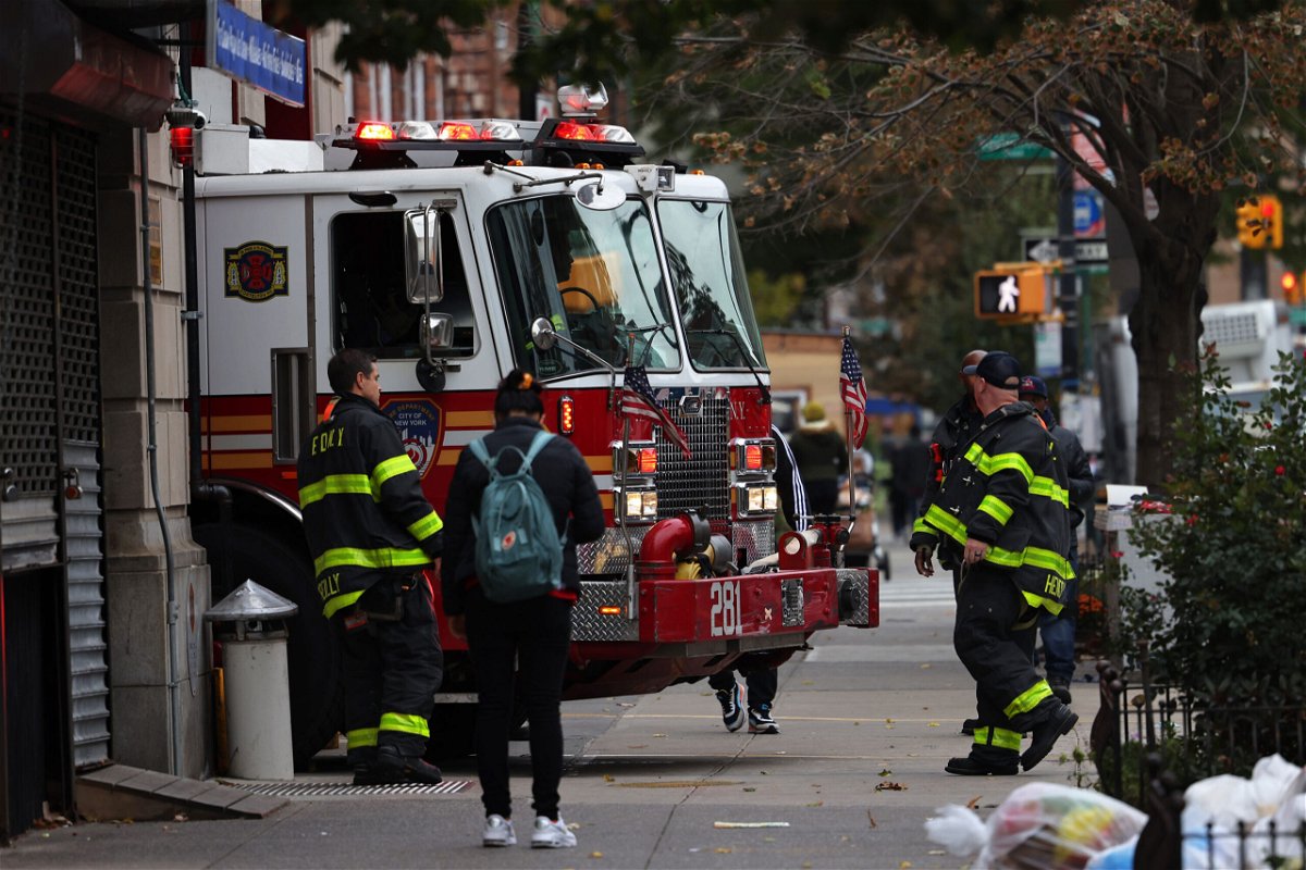 <i>Michael M. Santiago/Getty Images</i><br/>Members of the New York City fire and police departments and other city workers had until Friday evening to show proof they have received at least one dose of the Covid-19 vaccine or be placed on unpaid leave. Firefighters are shown here as their fire engine enters the FDNY Engine 281/Ladder 147 station on October 29
