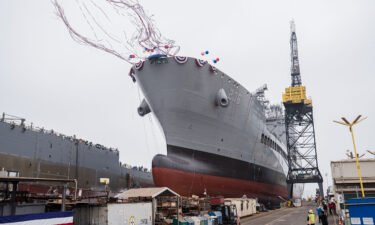 USNS Harvey Milk departs the General Dynamics NASSCO shipyard after a ceremonial address in San Diego