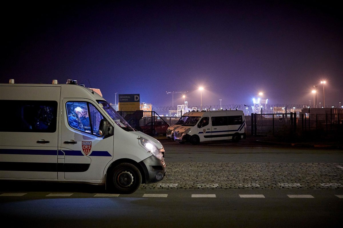 <i>Kiran Ridley/Getty Images</i><br/>Police seal off the area around the rescue operation at France's Calais harbor on November 24.