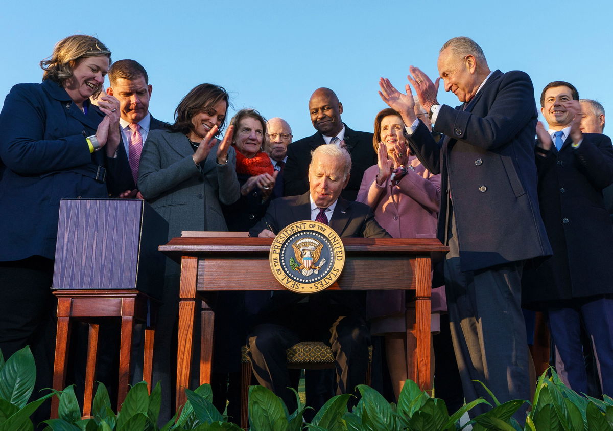<i>Mandel Ngan/AFP/Getty Images</i><br/>President Joe Biden heads to New Hampshire on Tuesday to sell his new infrastructure law. Biden is shown here with Vice President Kamala Harris in a signing ceremony for H.R. 3684