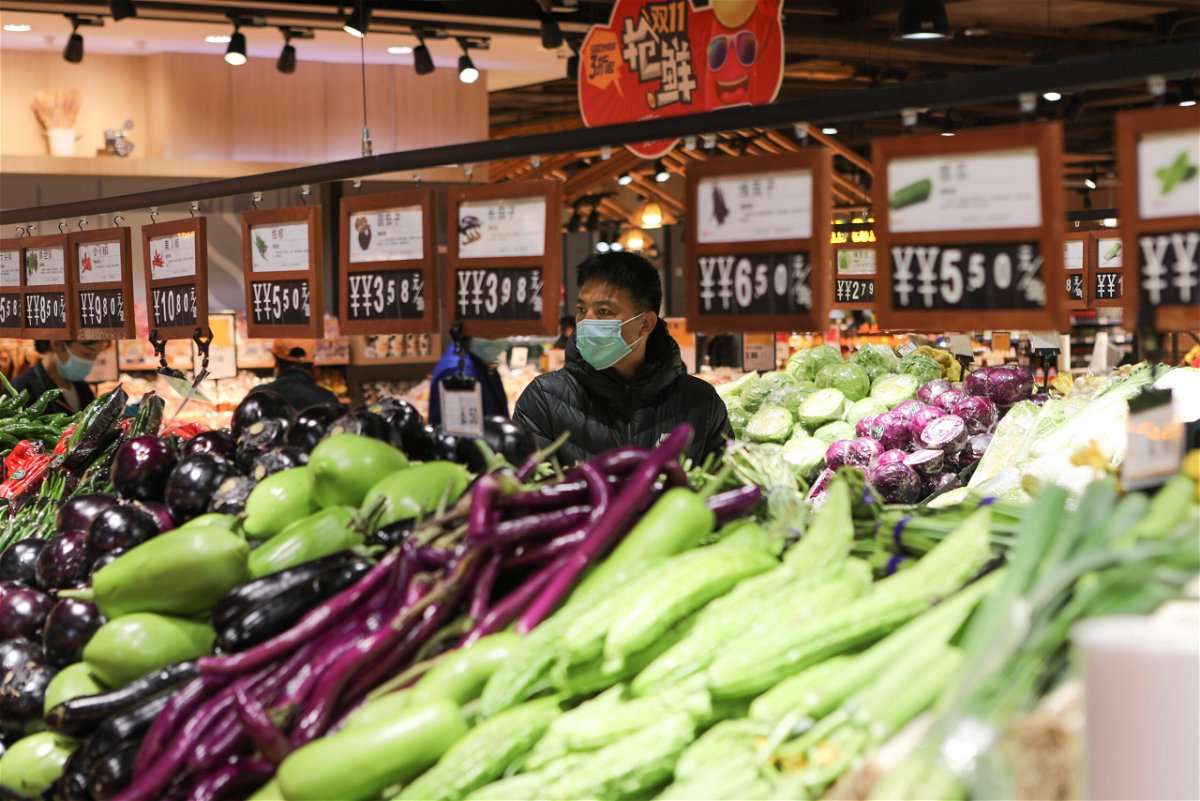 <i>Li Hao/VCG/Getty Images</i><br/>People buy vegetables at a supermarket at Congtai District on November 10