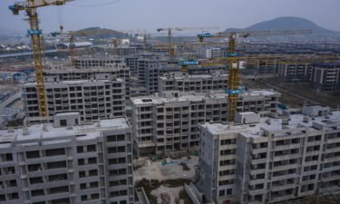 Unfinished apartment buildings at China Evergrande Group's Health Valley development on the outskirts of Nanjing