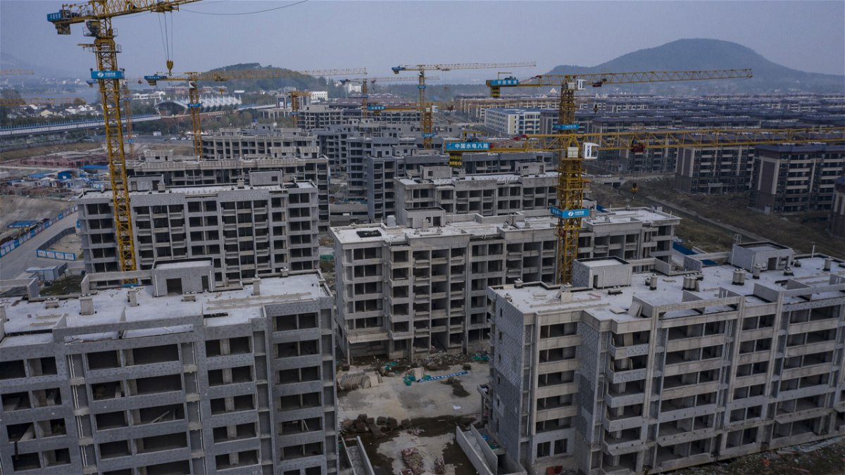 <i>Qilai Shen/Bloomberg/Getty Images</i><br/>Unfinished apartment buildings at China Evergrande Group's Health Valley development on the outskirts of Nanjing