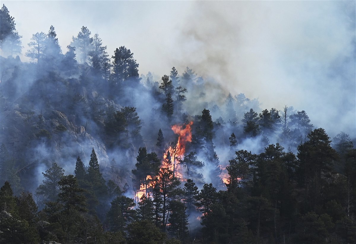 <i>RJ Sangosti/AP</i><br/>The Kruger Rock Fire burns in Estes Park