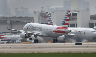 American Airlines is giving flight attendants who work during the holidays a one-time holiday pay premium. An American Airlines plane is shown here taking off at the Miami International Airport on June 16