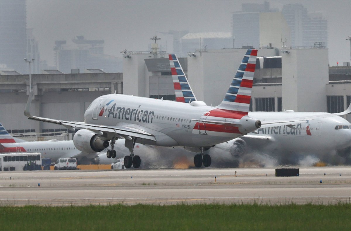 <i>Joe Raedle/Getty Images</i><br/>American Airlines is giving flight attendants who work during the holidays a one-time holiday pay premium. An American Airlines plane is shown here taking off at the Miami International Airport on June 16