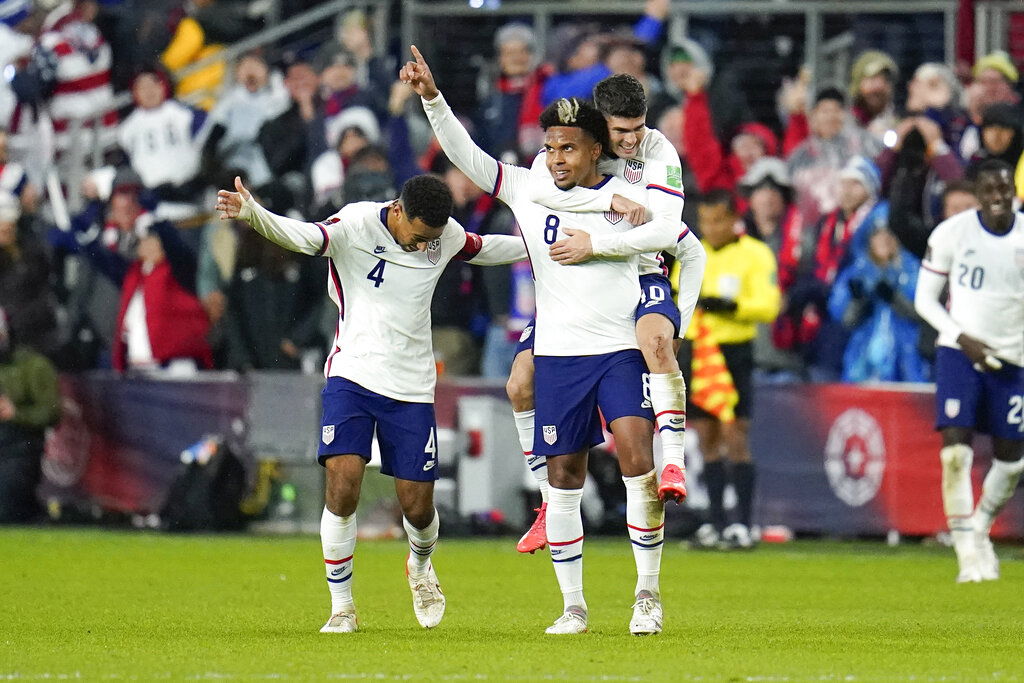 United States' Weston McKennie celebrates his goal with Tyler Adams, left, and Christian Pulisic during a World Cup qualifying soccer match against Mexico.