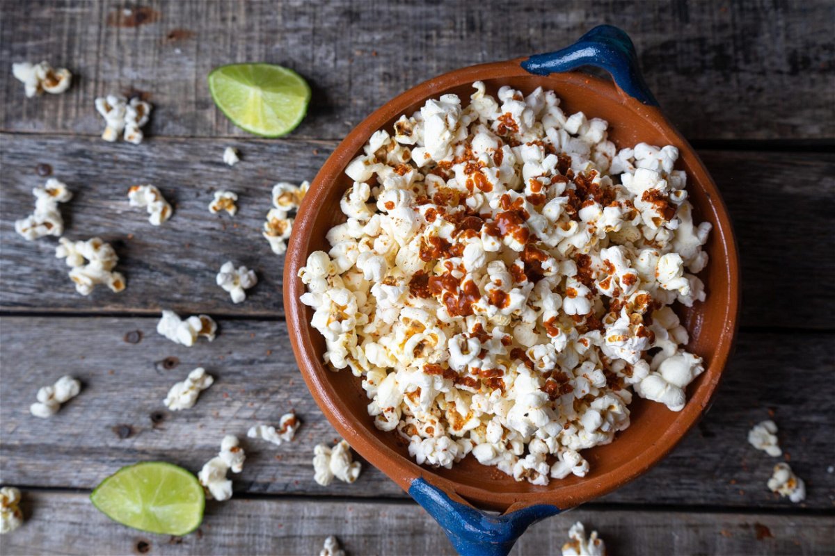<i>iStockphoto/Getty Images</i><br/>Freshly made popcorn spiked with fresh lime juice and zest is a tangy treat