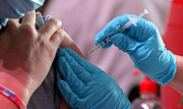 Millions of US workers are already required to show proof of a Covid-19 vaccine to their employer. Soon many could be forced to show proof that they also got a booster shot.